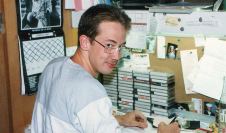 College freshman Andrew at his desk
