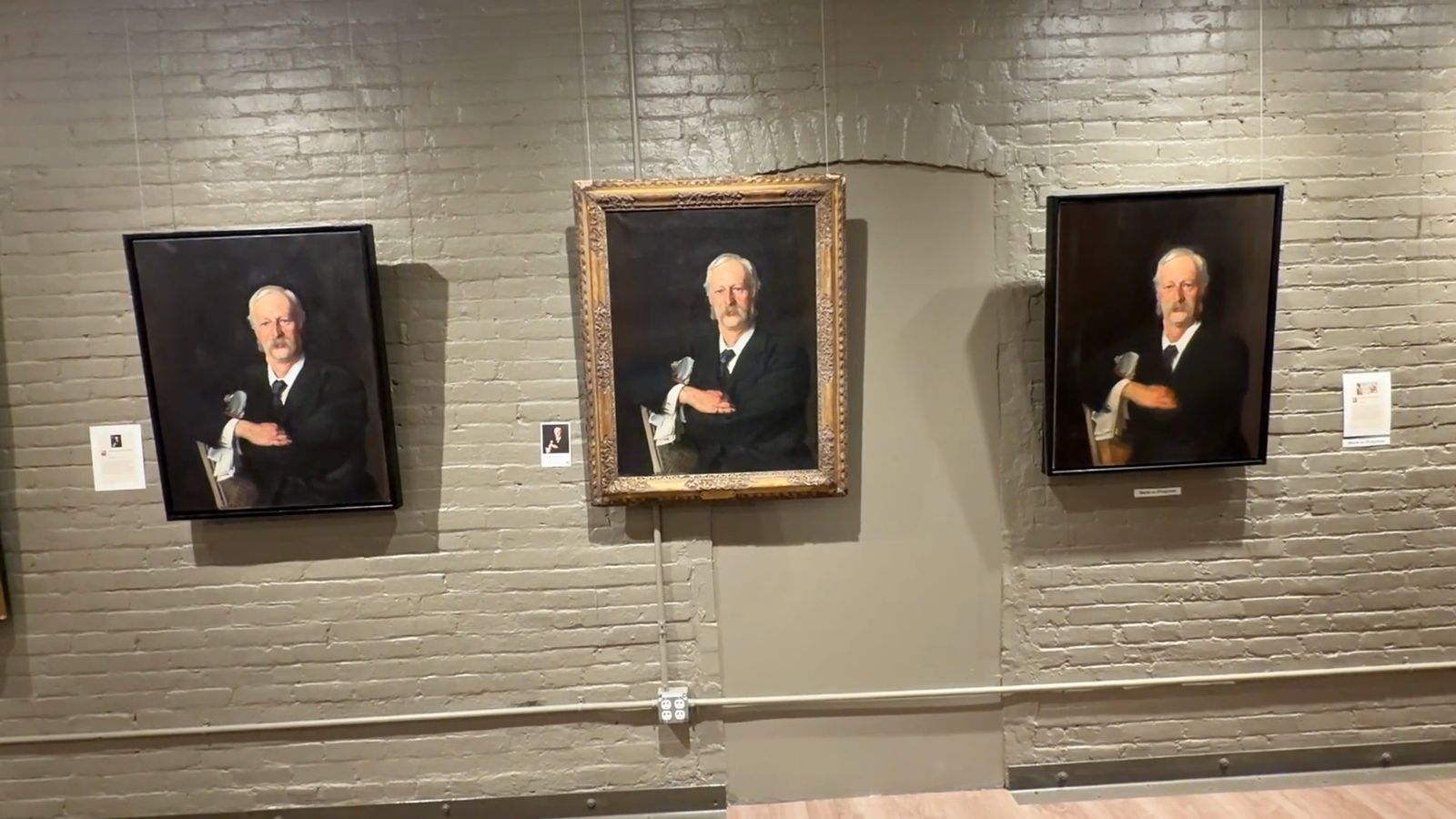 Three portraits of the same man hanging side by side